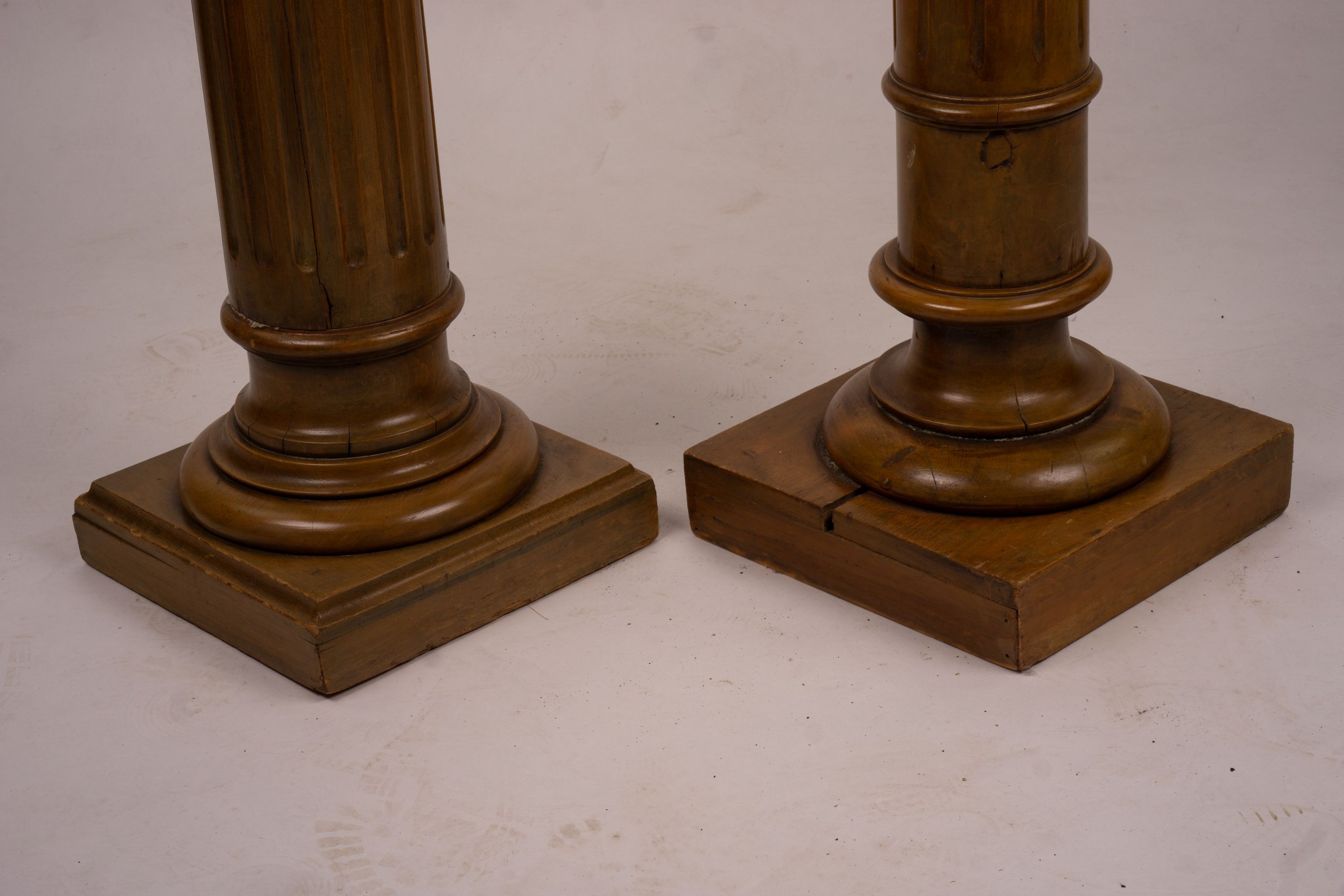 A pair of Victorian style carved beech and walnut pedestals, height 110cm